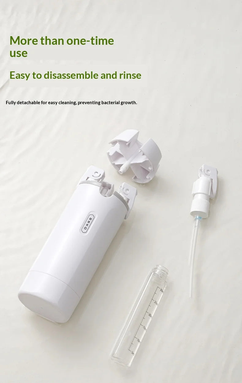 White dental cleaning device with detachable parts on a light background