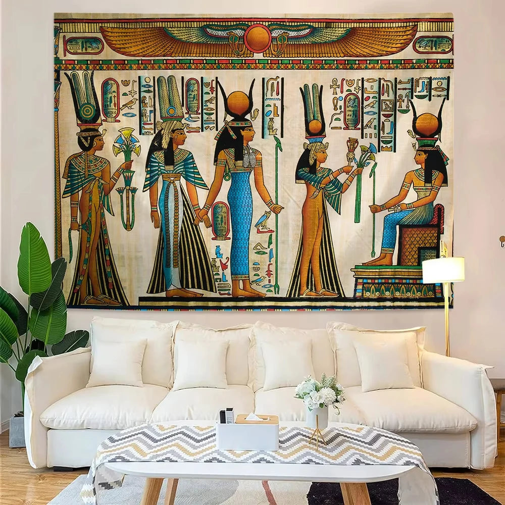 Living room with Egyptian-themed tapestry above a white sofa