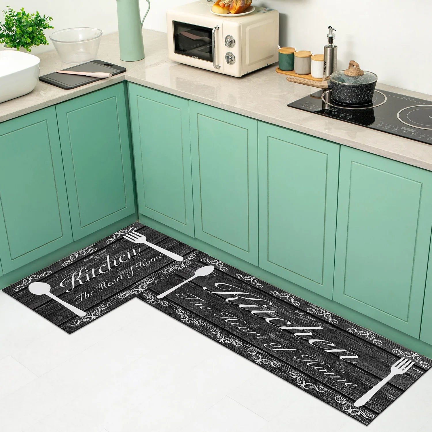 Two kitchen mats with utensils and text on a kitchen floor.