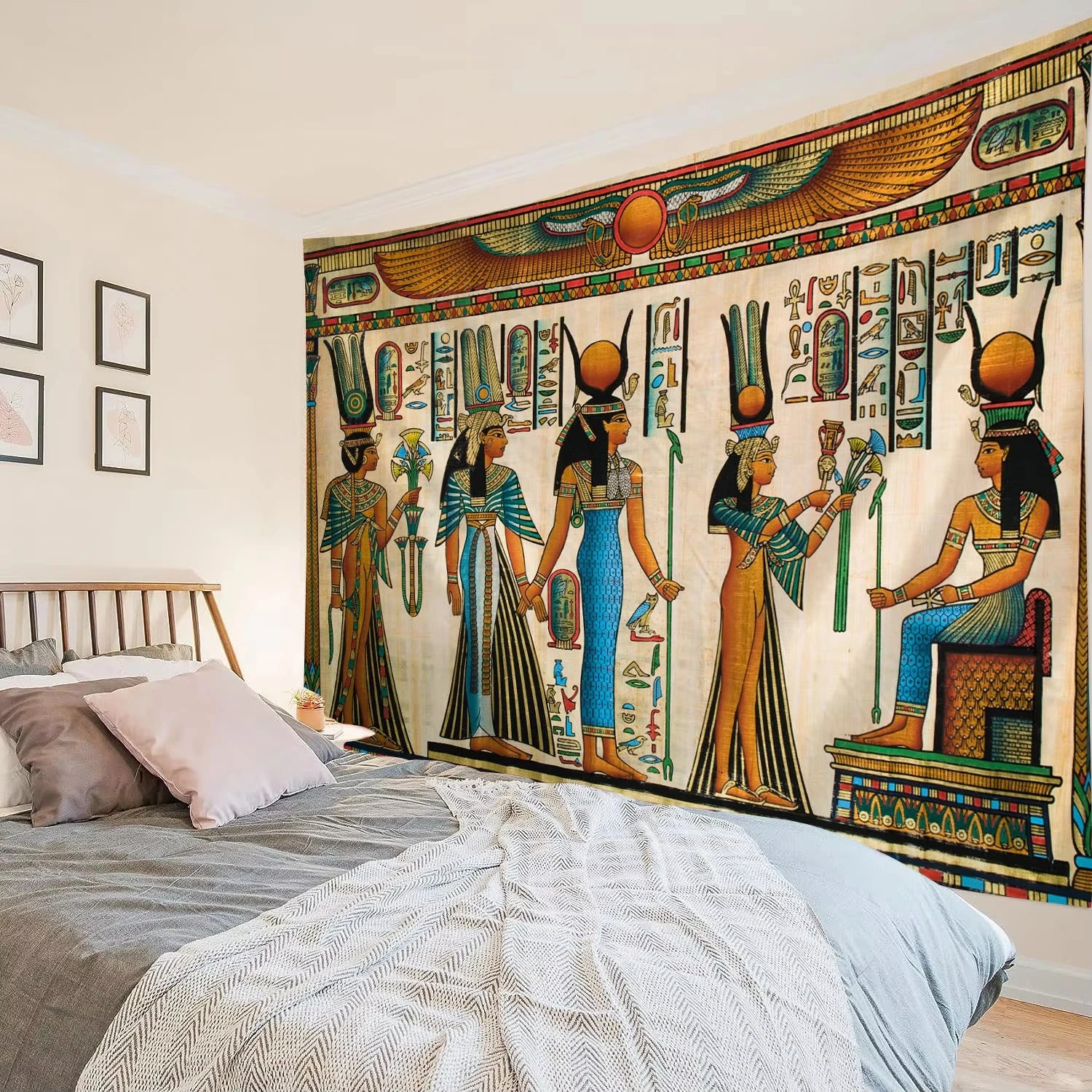 Bedroom with Egyptian-themed tapestry on the wall