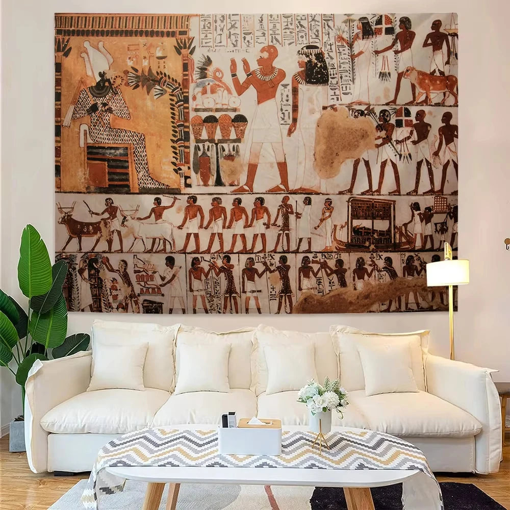 Living room with a large tapestry depicting ancient Egyptian scenes on the wall above a white sofa.