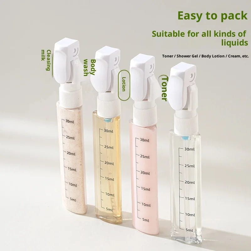 Four small spray bottles with量刻度 on a white background, labeled for different uses.