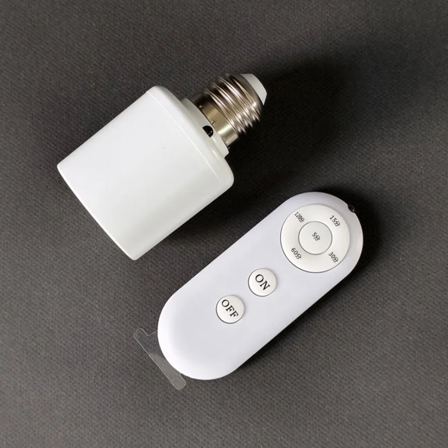Light bulb adapter with remote control on a dark surface