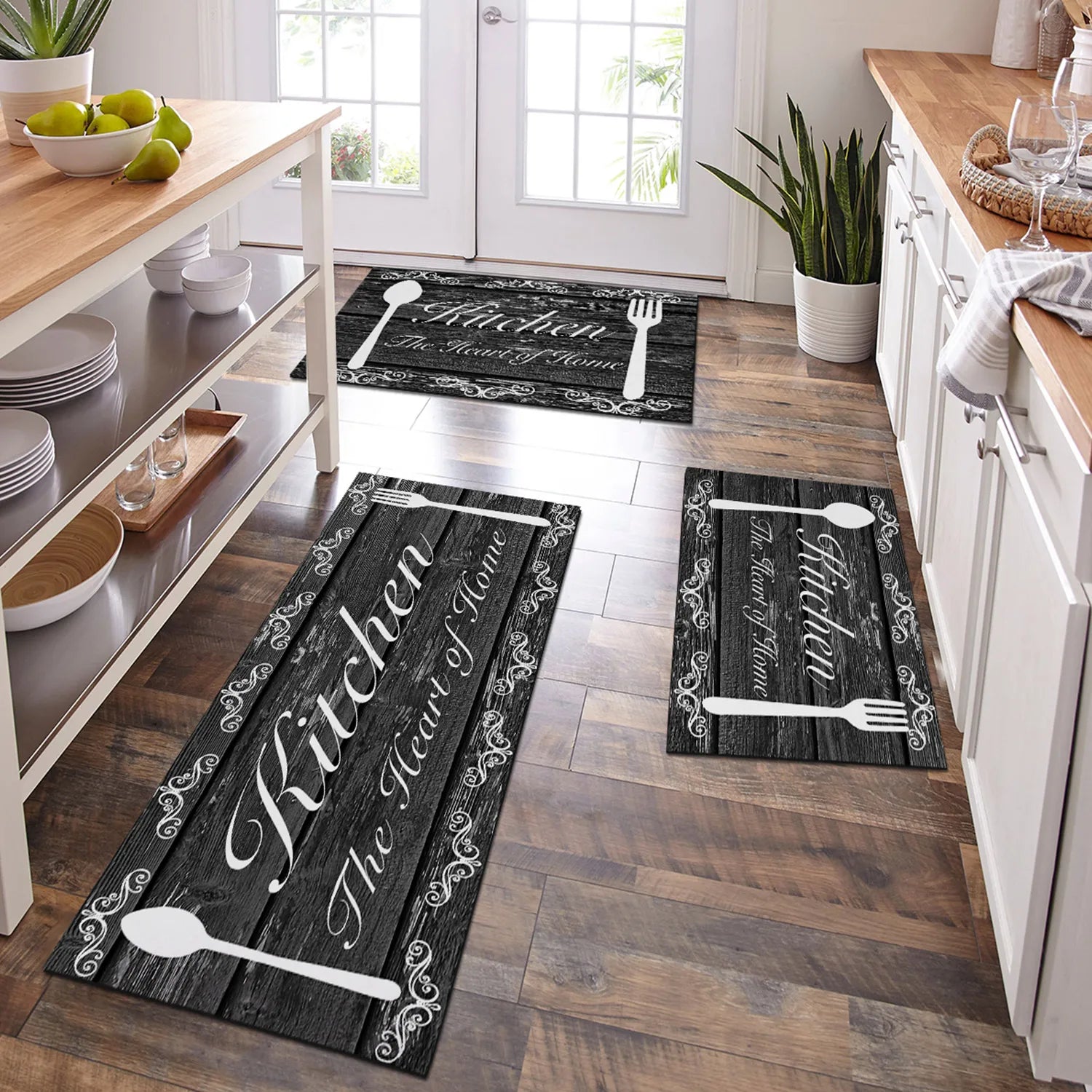 Kitchen floor with decorative rugs featuring utensils and text