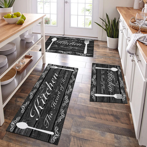 Kitchen floor with decorative rugs featuring utensils and text