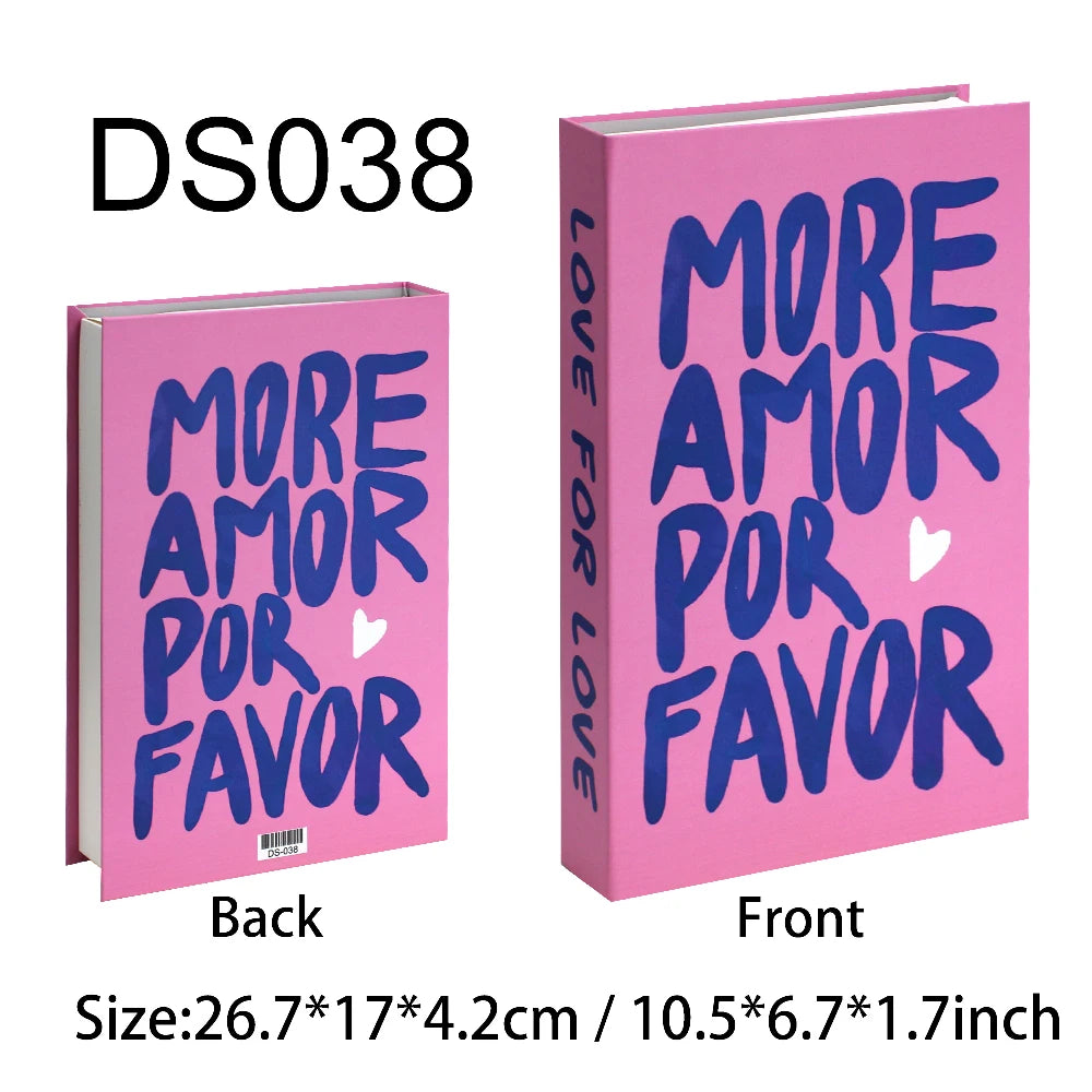 Pink book with blue text 'More Amor Por Favor' on a white background