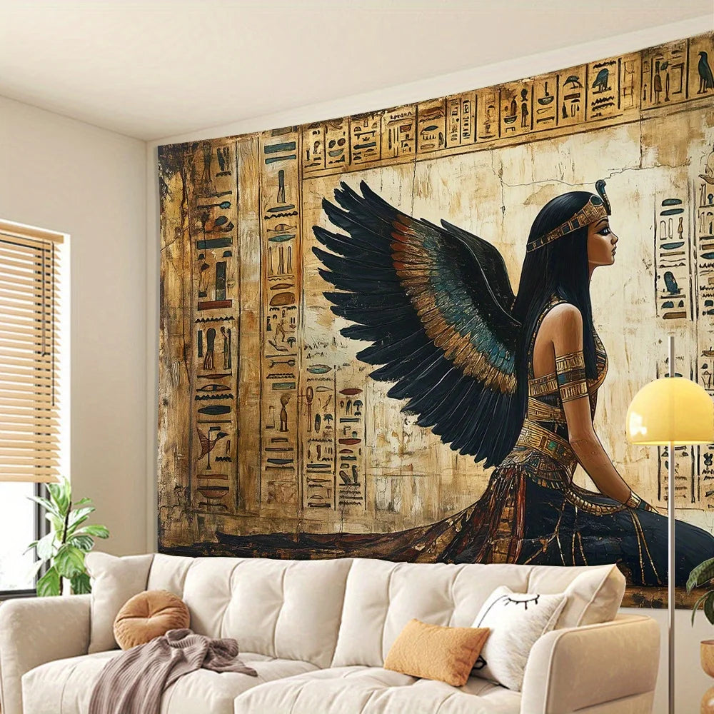 Decorative tapestry with an angelic figure and hieroglyphics on a wall above a sofa.
