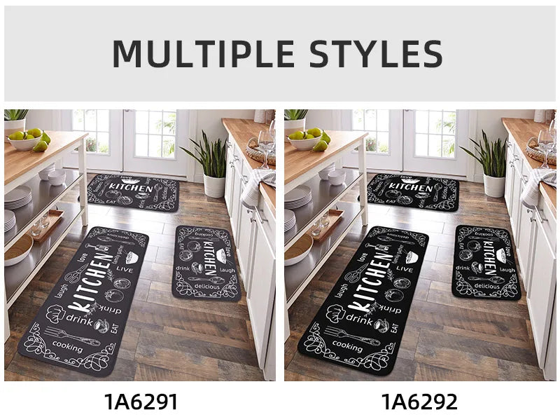 Black kitchen rugs with white text on a wooden floor in a kitchen setting.