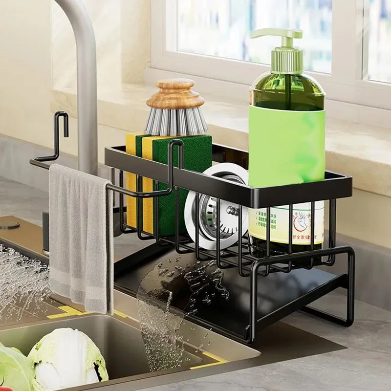 Kitchen sink area with a black dish rack holding cleaning supplies and a green bottle.