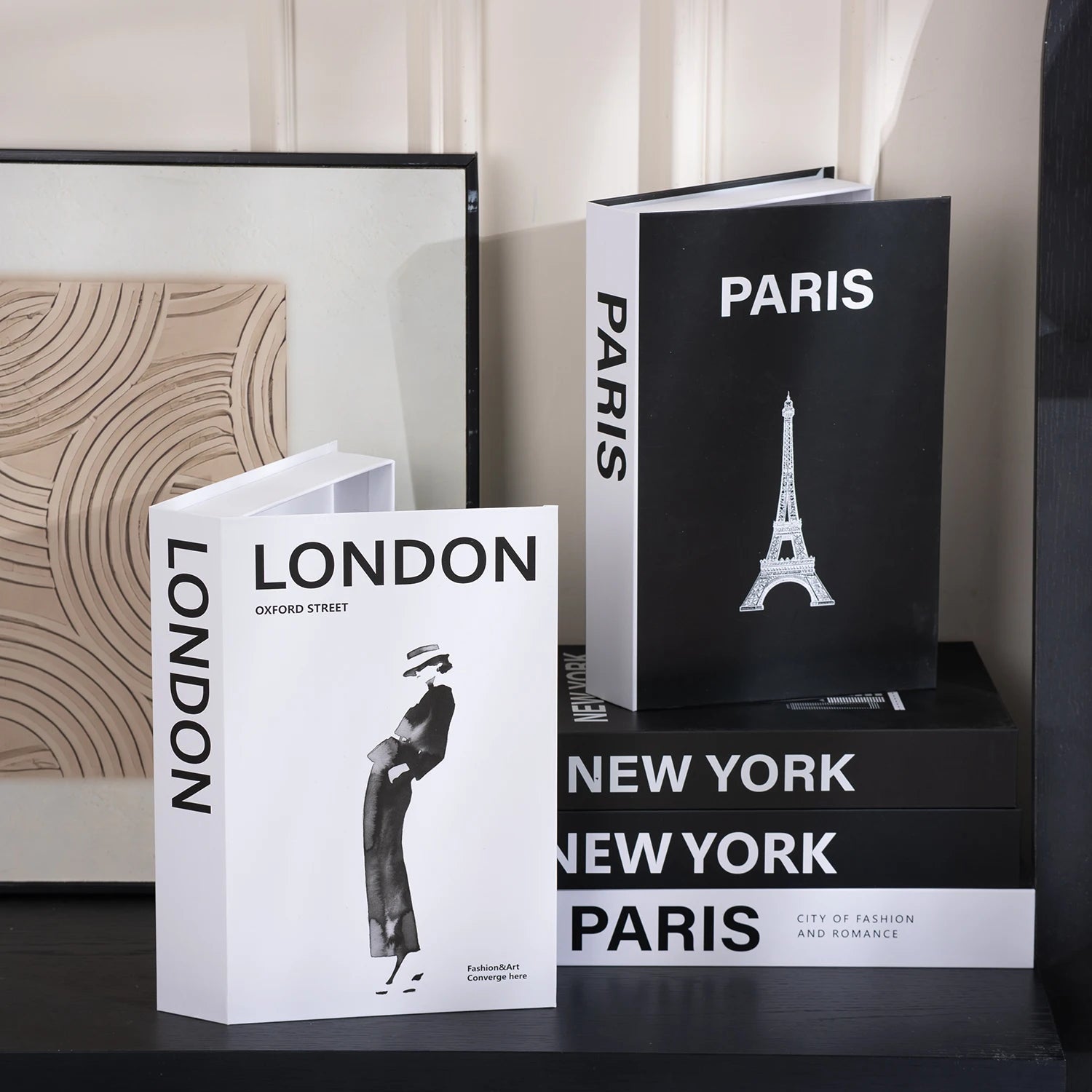 Books titled 'London', 'Paris', and 'New York' with Eiffel Tower illustration on a shelf.