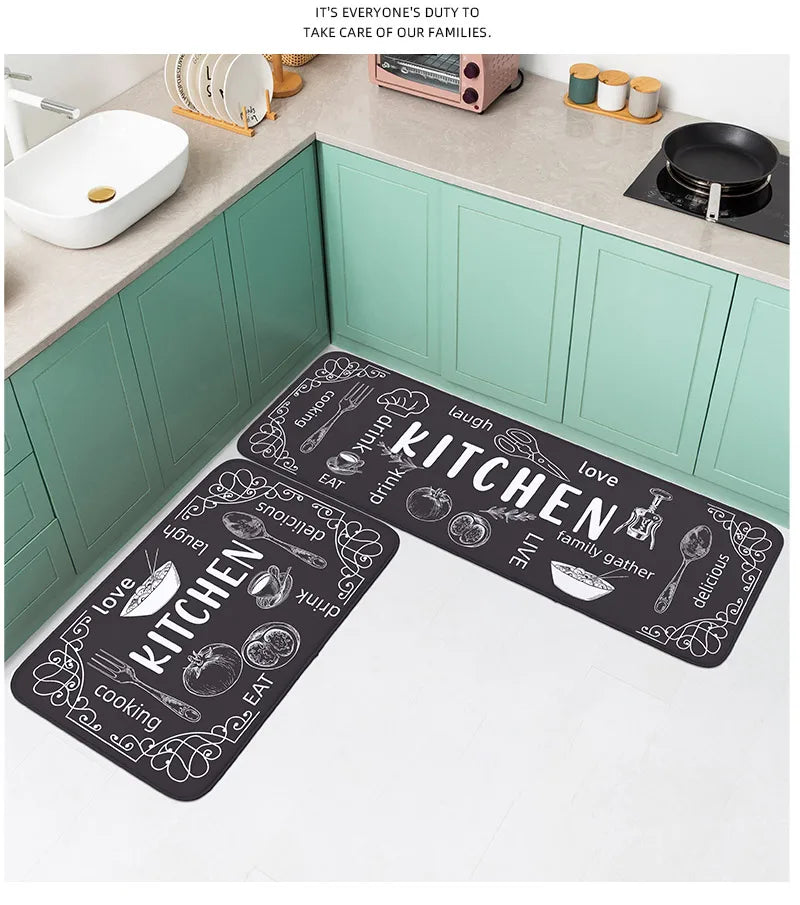 Kitchen mat with decorative text and symbols on a kitchen floor.