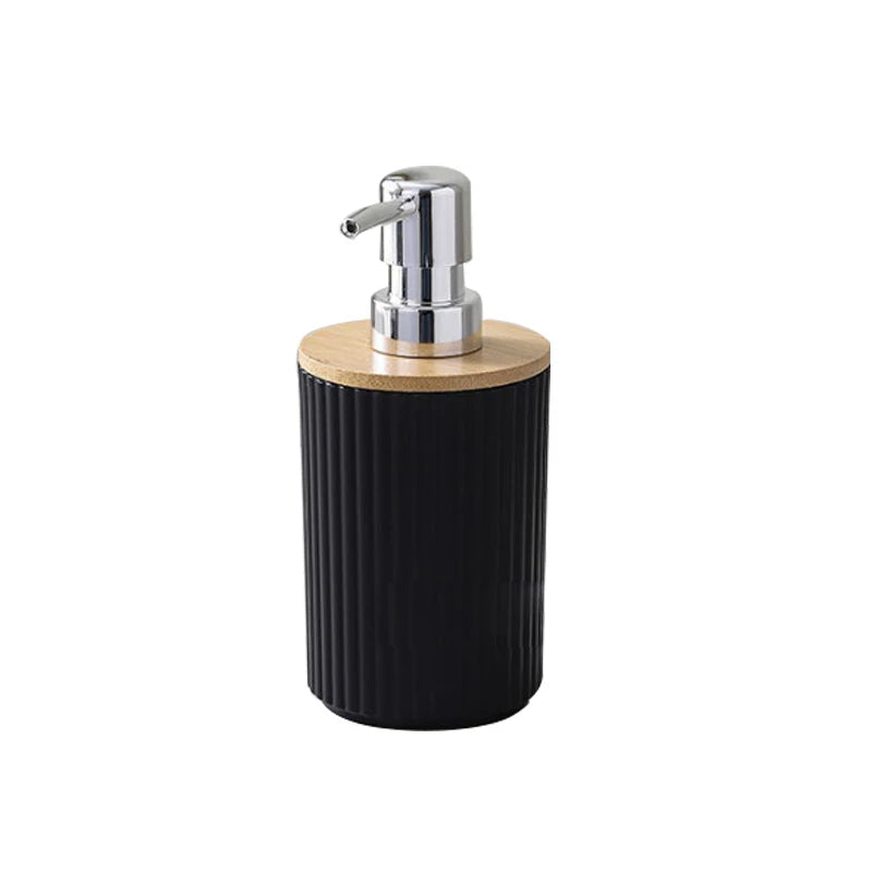 Black soap dispenser with wooden top and silver pump on a white background